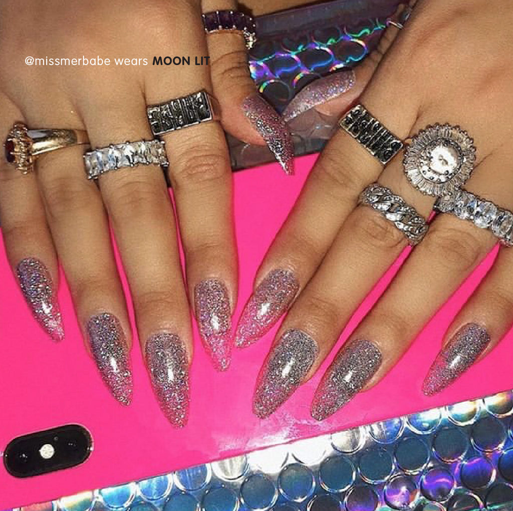 Influencer wears long ballerina press on nails in holographic lilac glitter