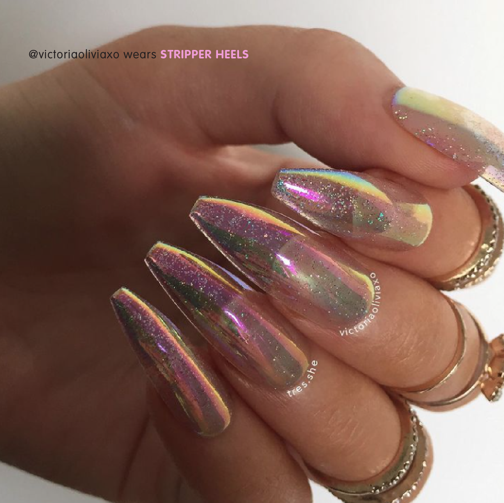 Influencer wearing Tres She instant acrylic press on nails in holographic and iridescent glitter sheer jelly long tapered ballerina shape